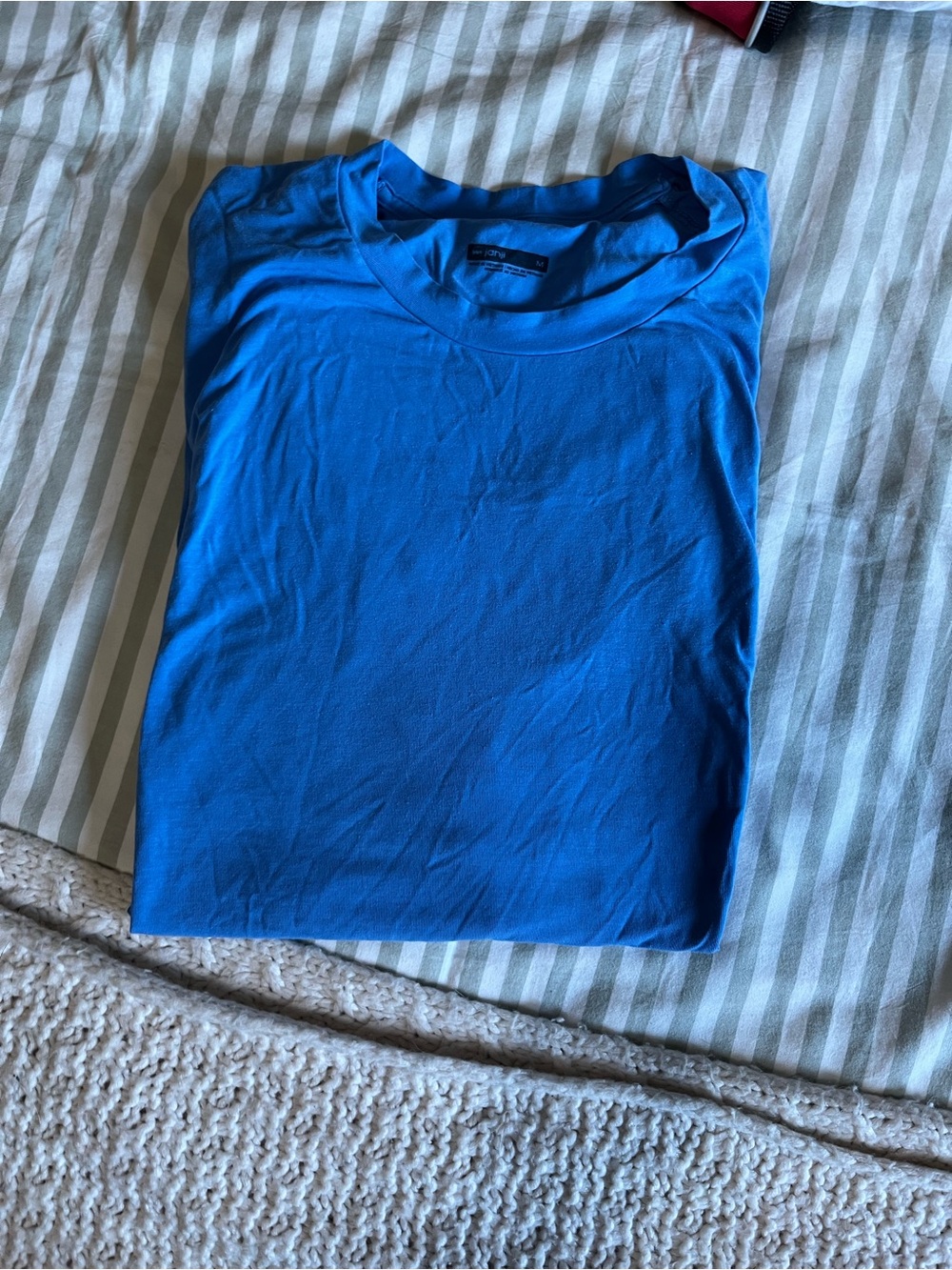 Men’s blue Janji running shirt